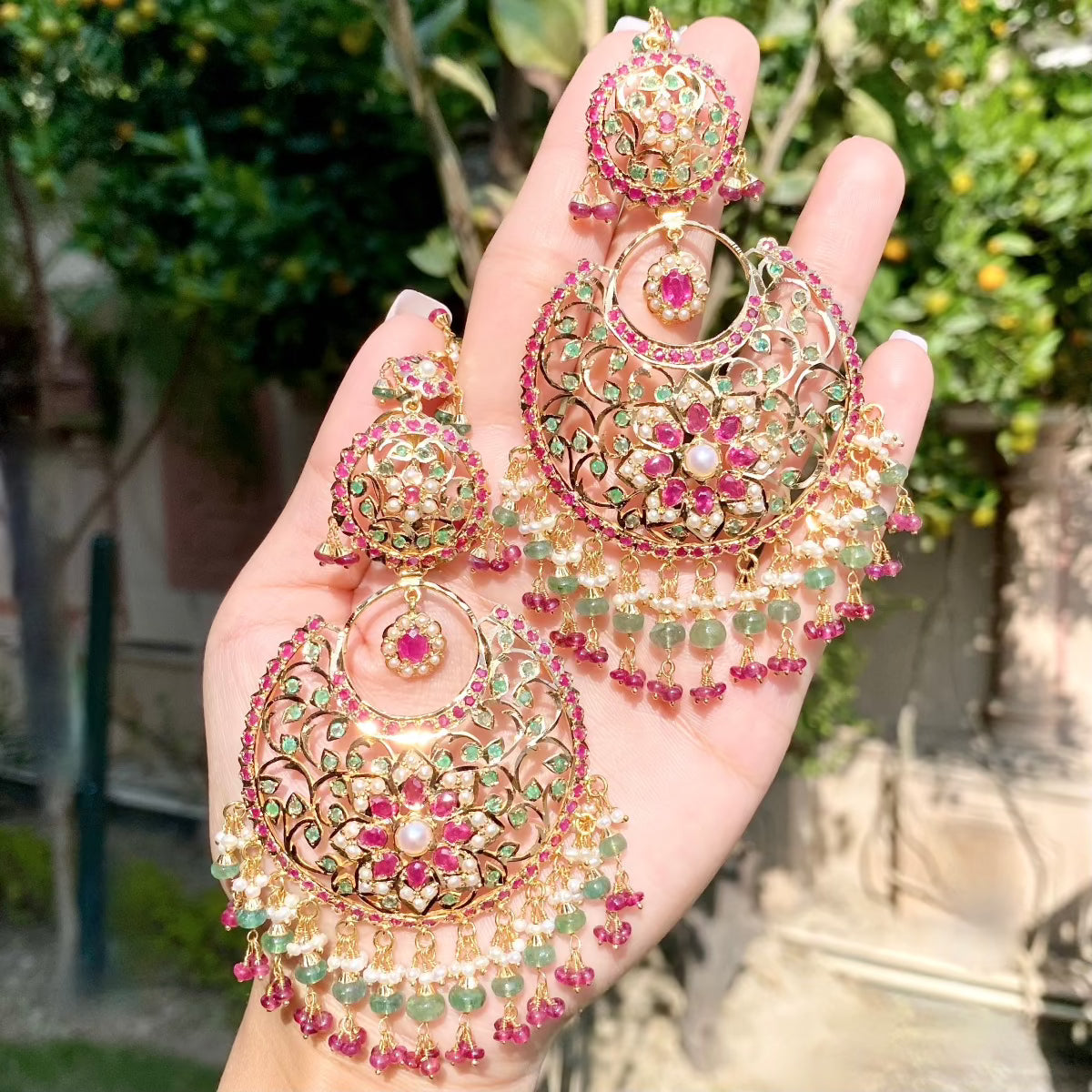 big statement chandbali earrings on 22k gold studded with precious rubies emerald and pearls