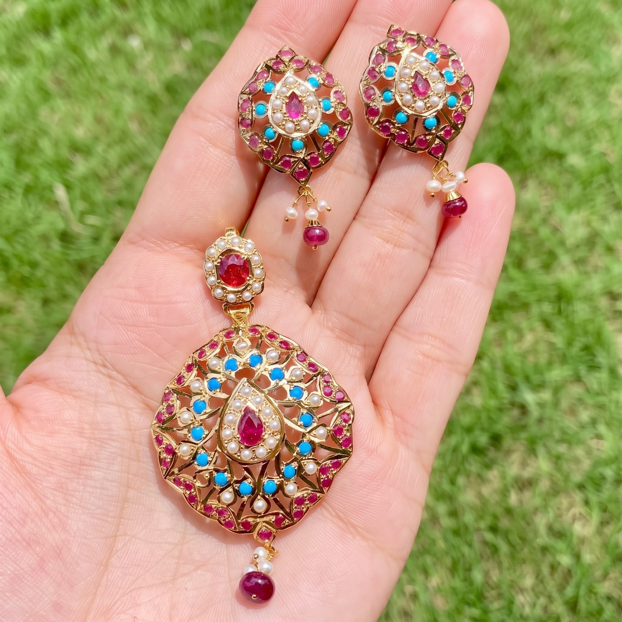 buy Gold pendant set studded with ruby, pheroza and pearls