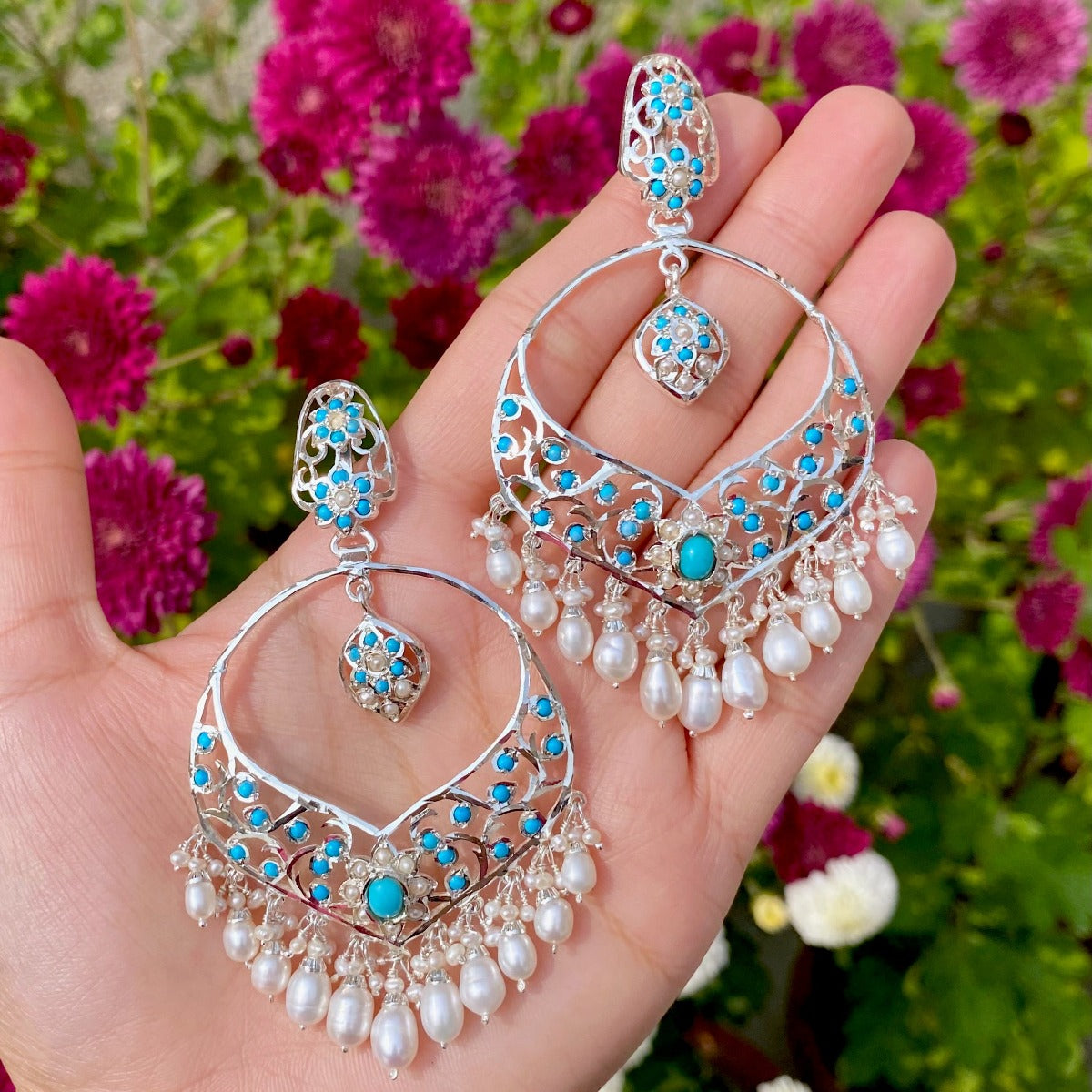 silver chandbali earrings with graduating pearl drops