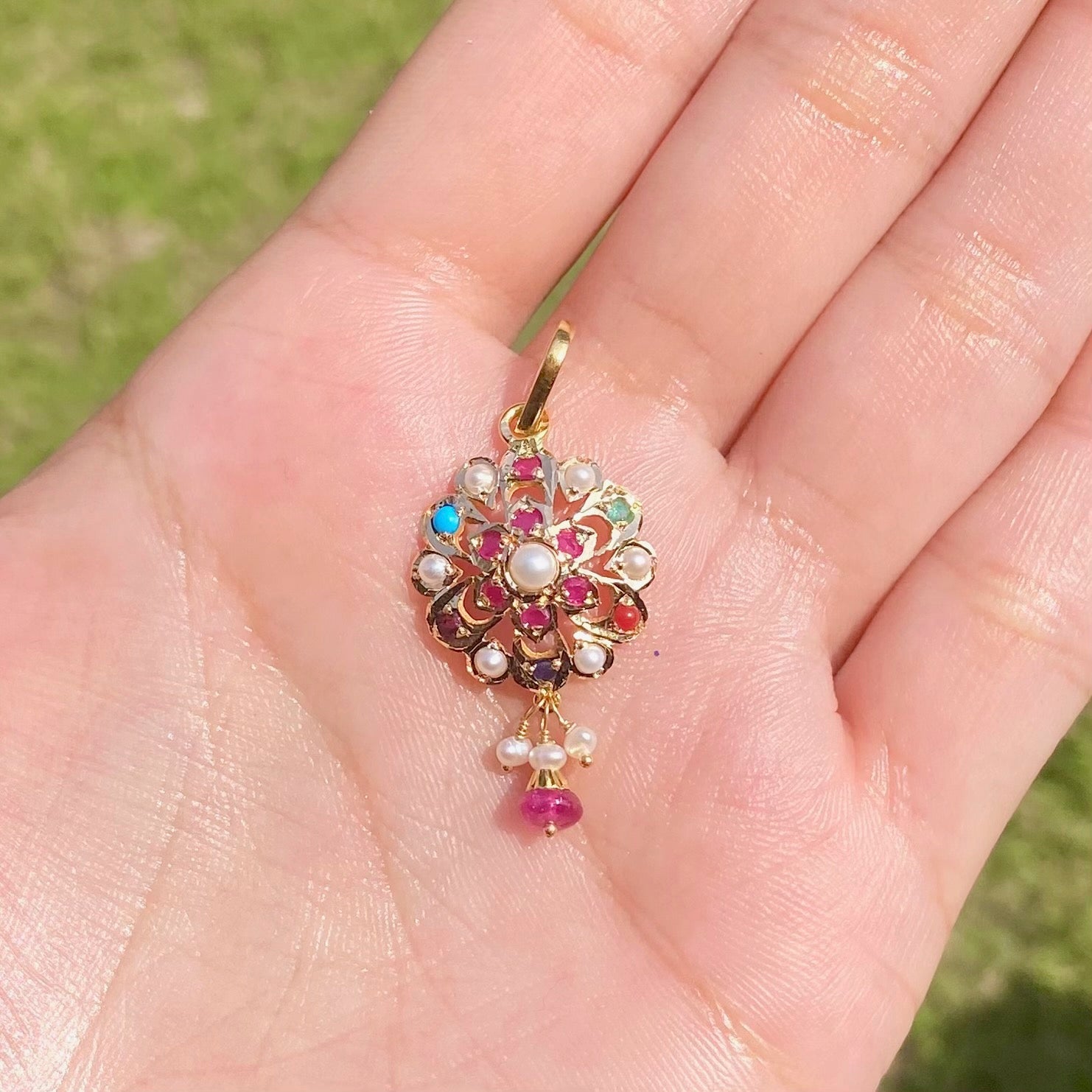 round navratna pendant only in 22k gold studded with precious stones gp 009