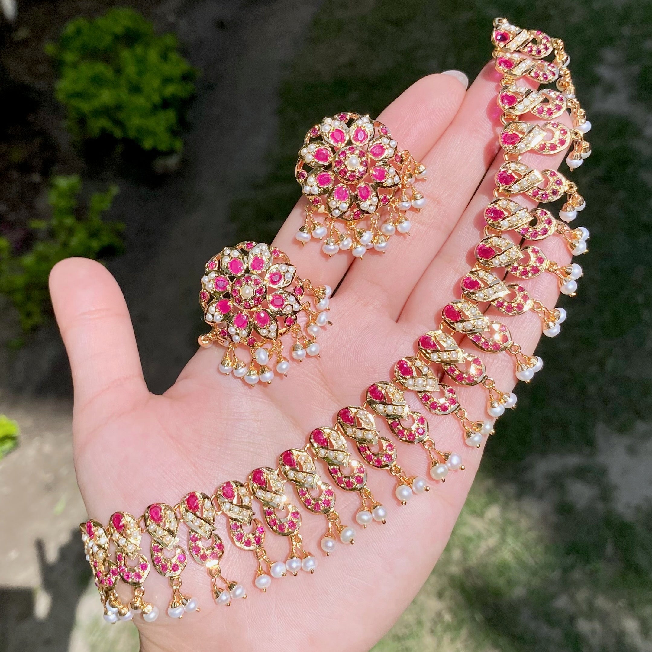 jadau set with ruby like red stones