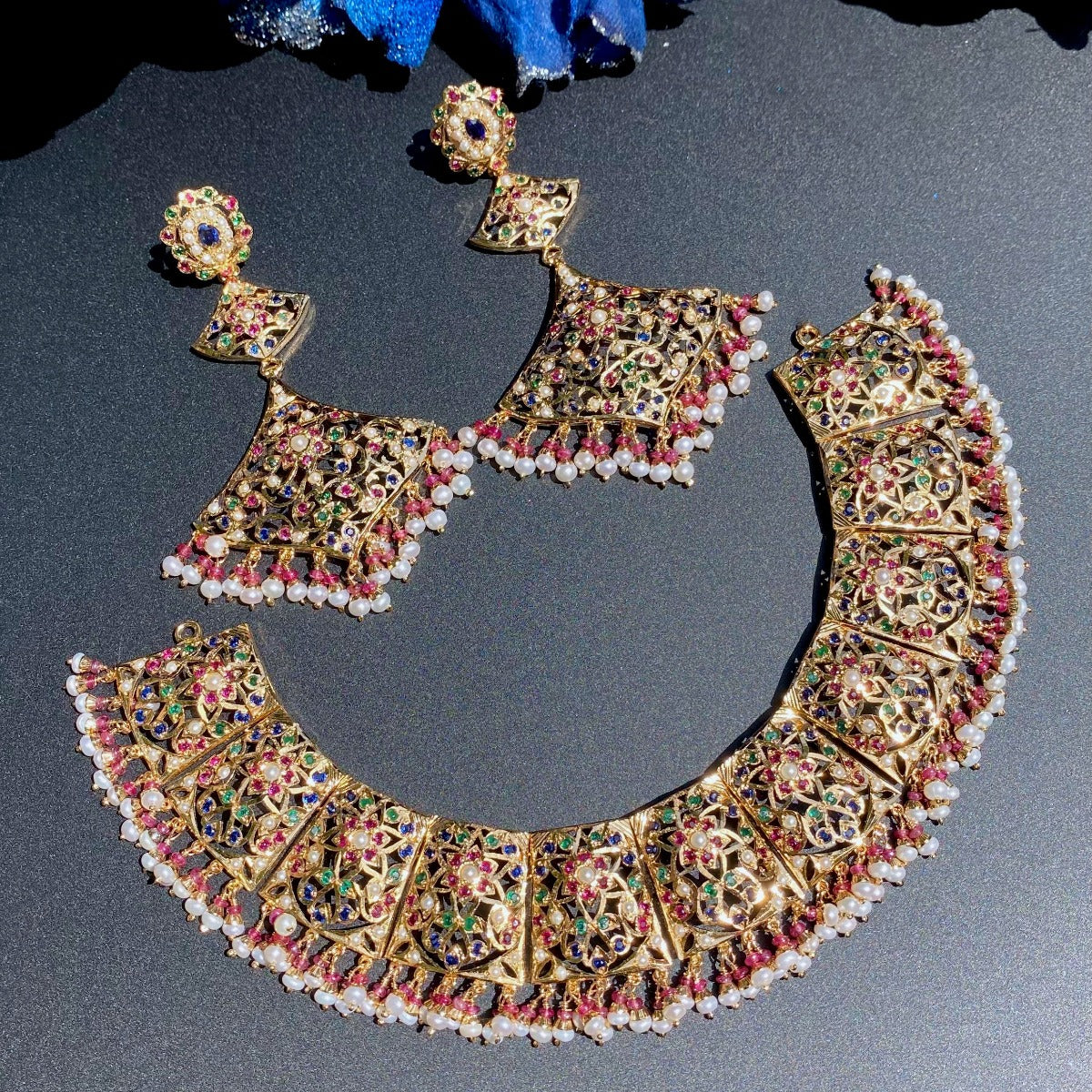broad necklace set with neelam blue sapphire stones