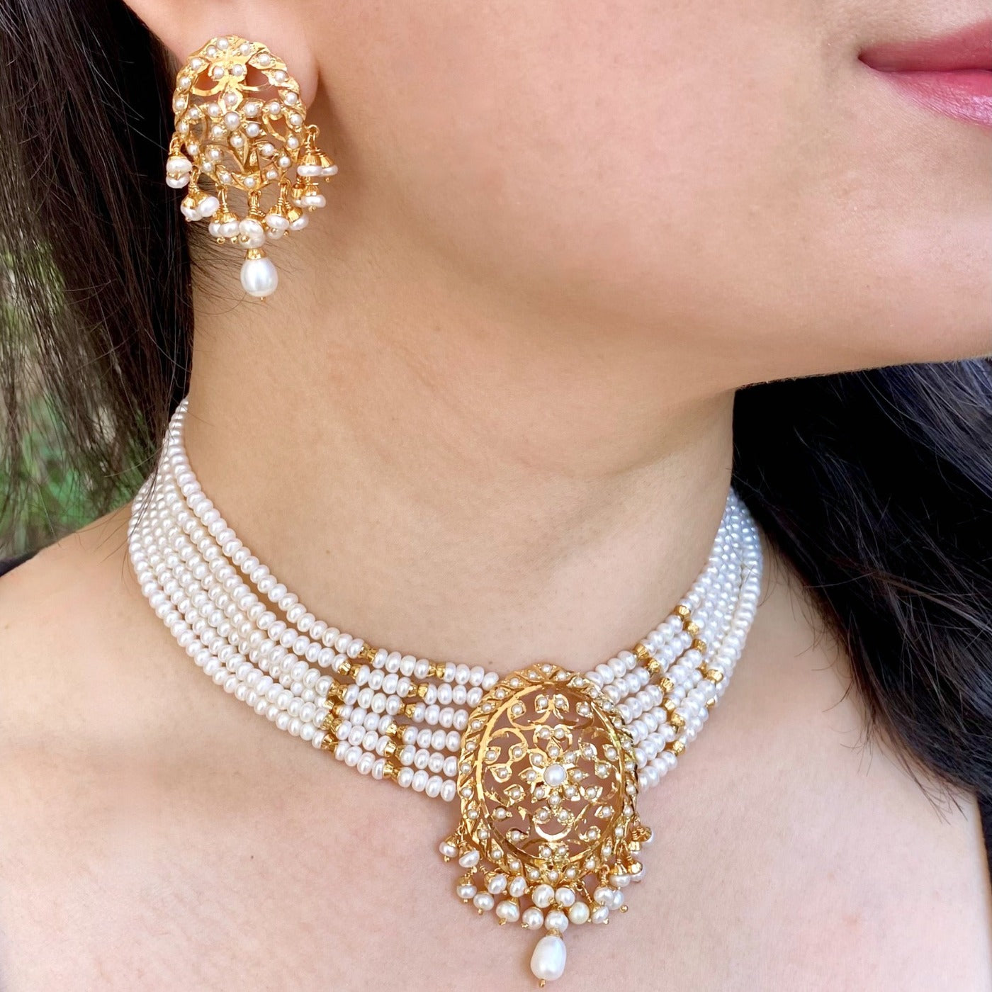 gold plated pearl choker on silver base