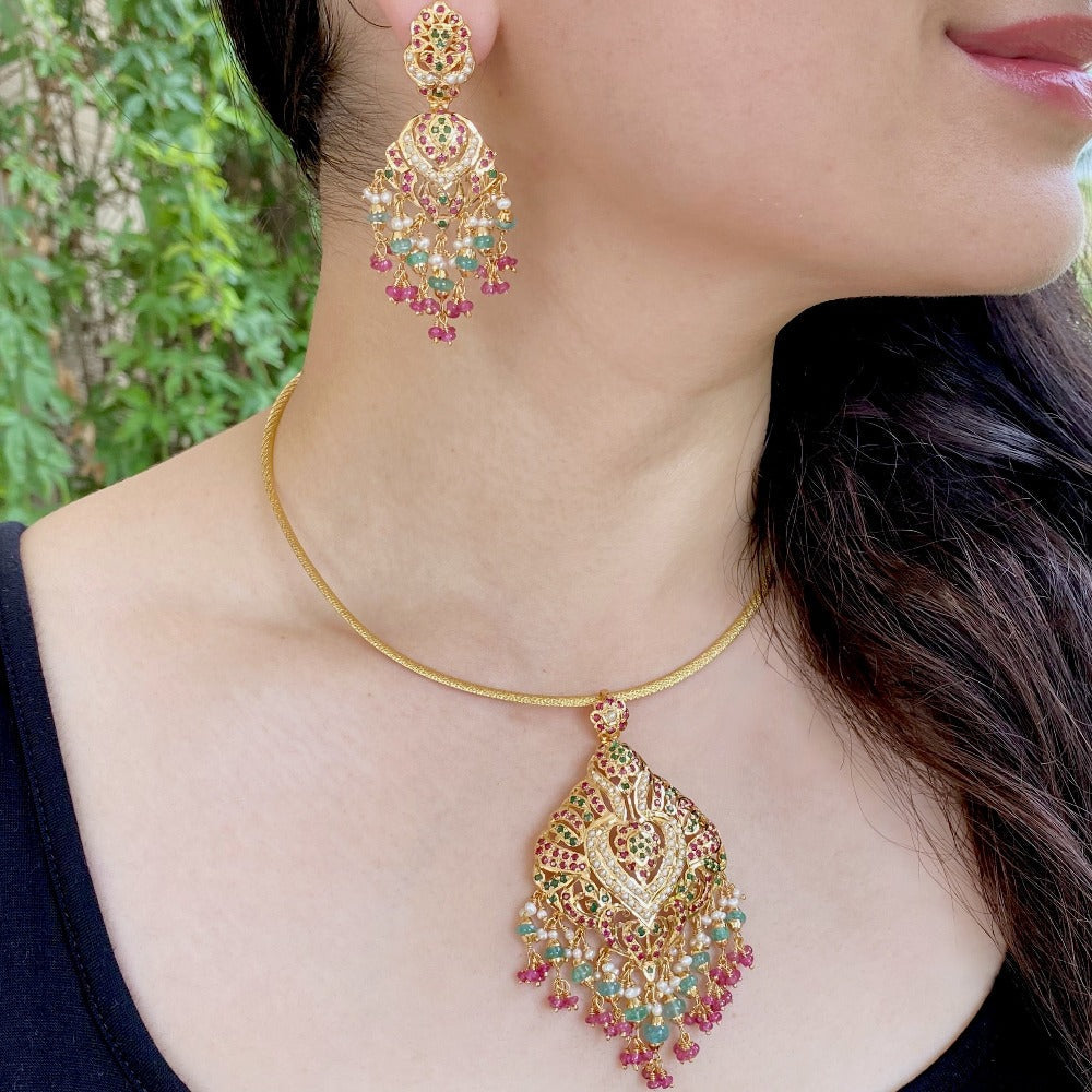 jadau pendant set in gold polished silver