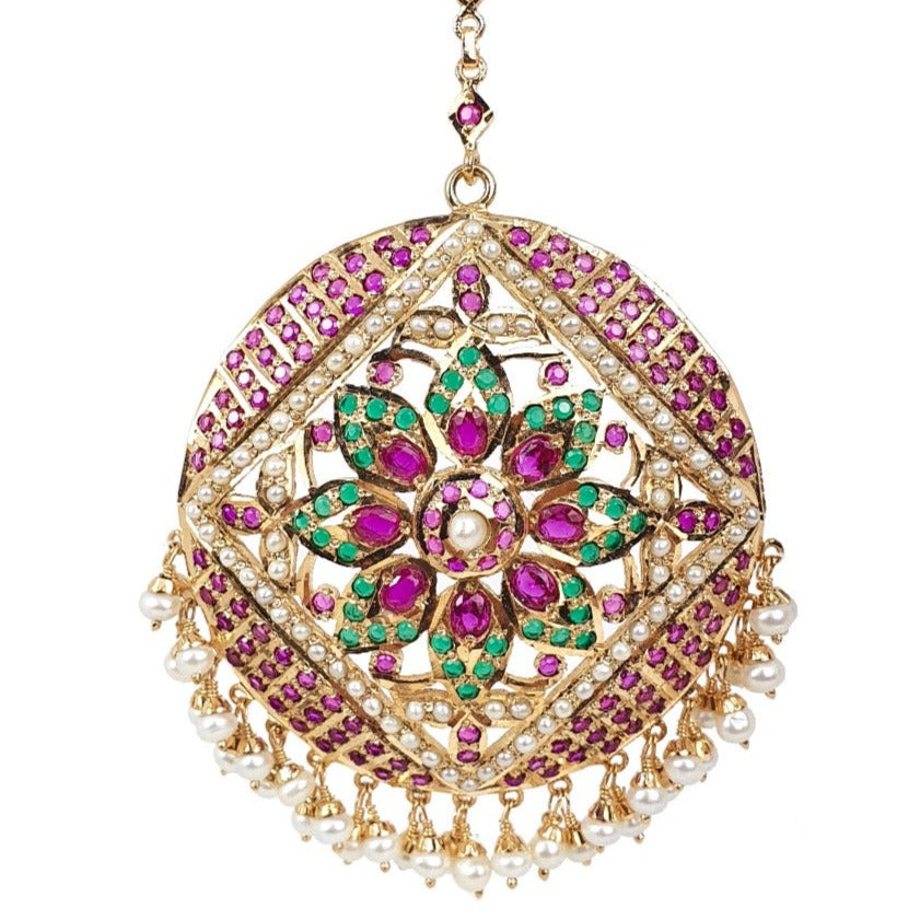 bridal round mang teeka design studded with ruby emerald and pearls