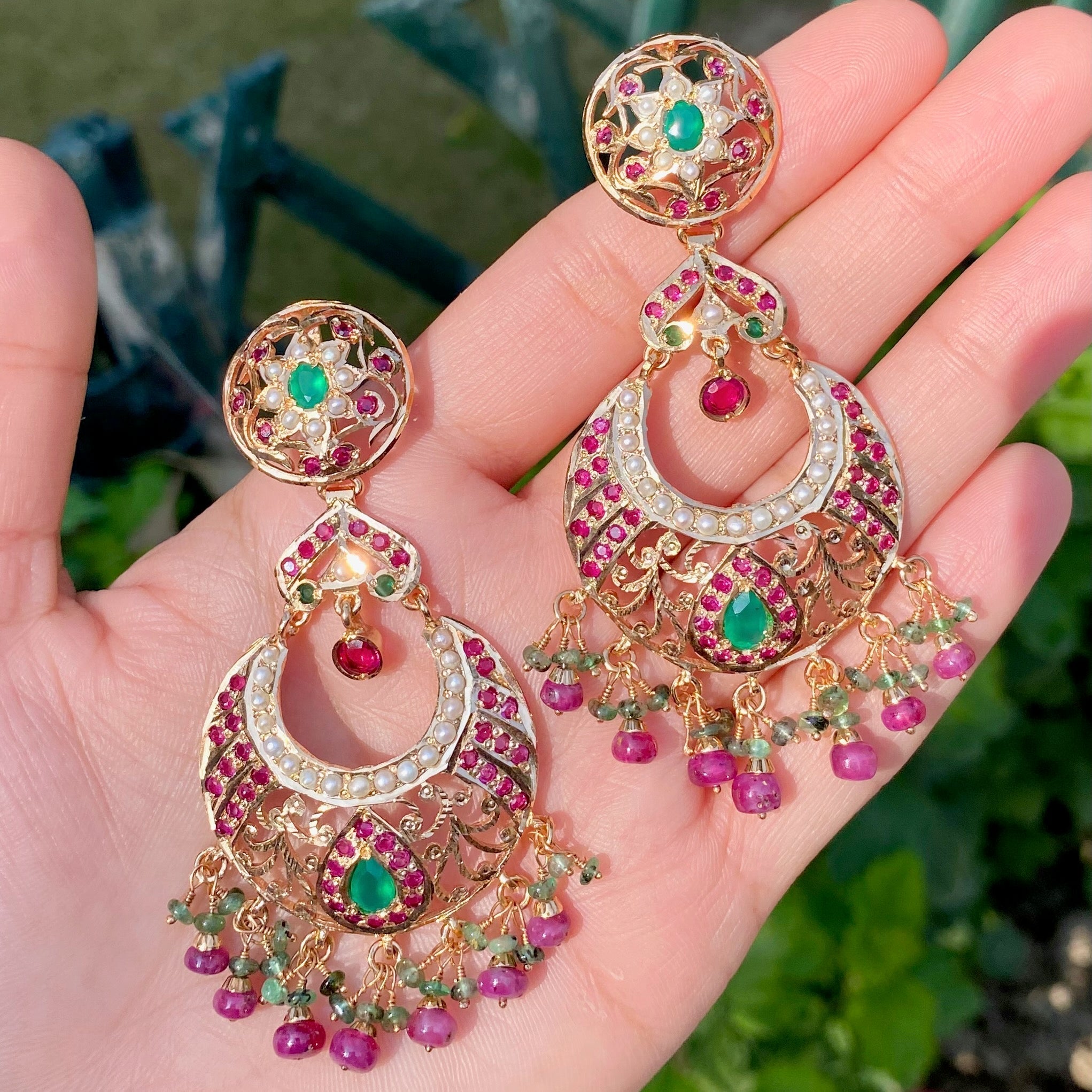 chandbali earrings studded with pearls and ruby emerald stones