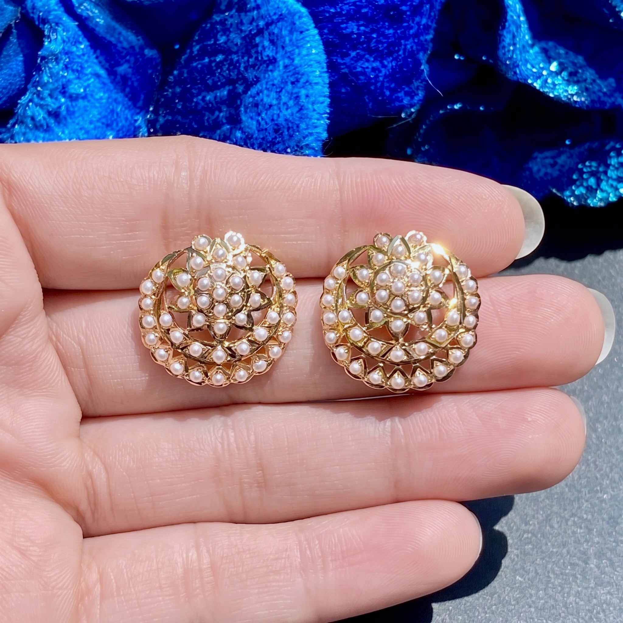 gold stud earrings embellished with pearls