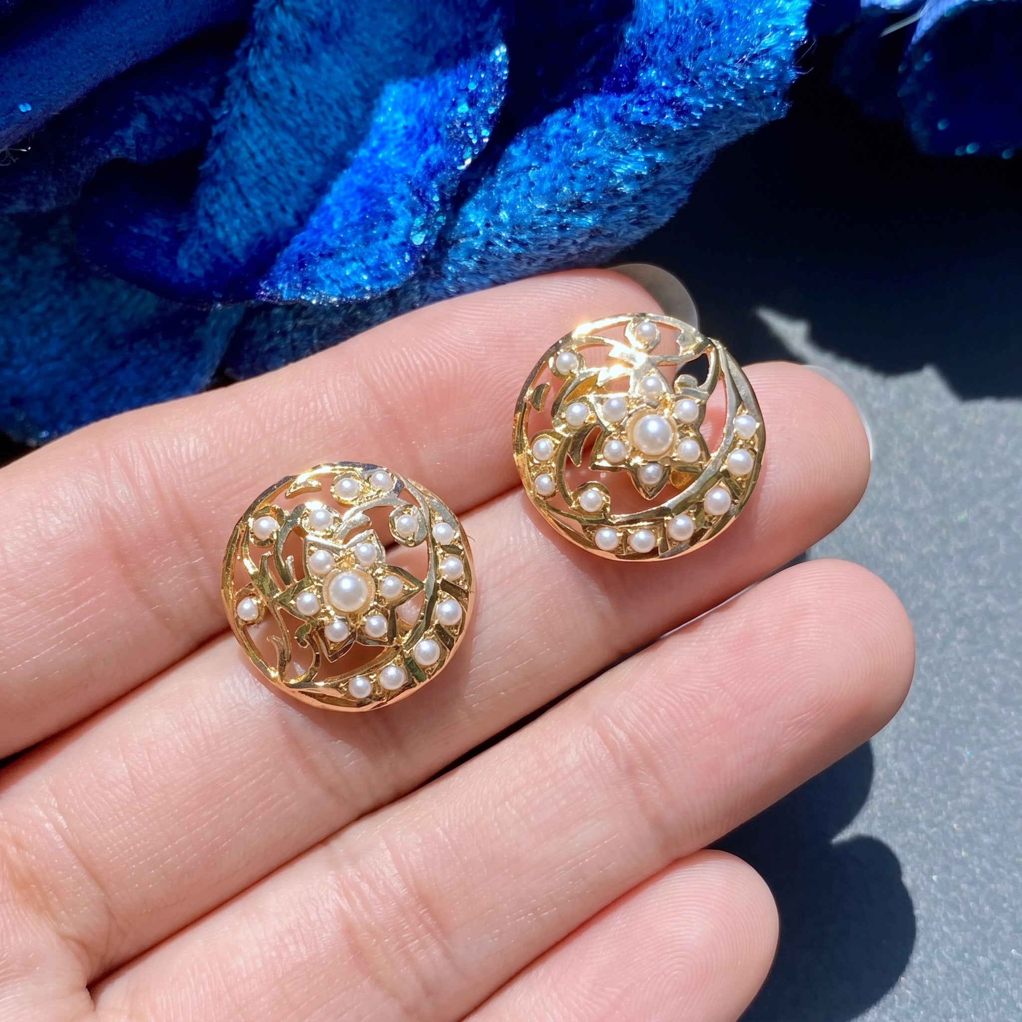 gold stud earrings embelished with freshwater pearls