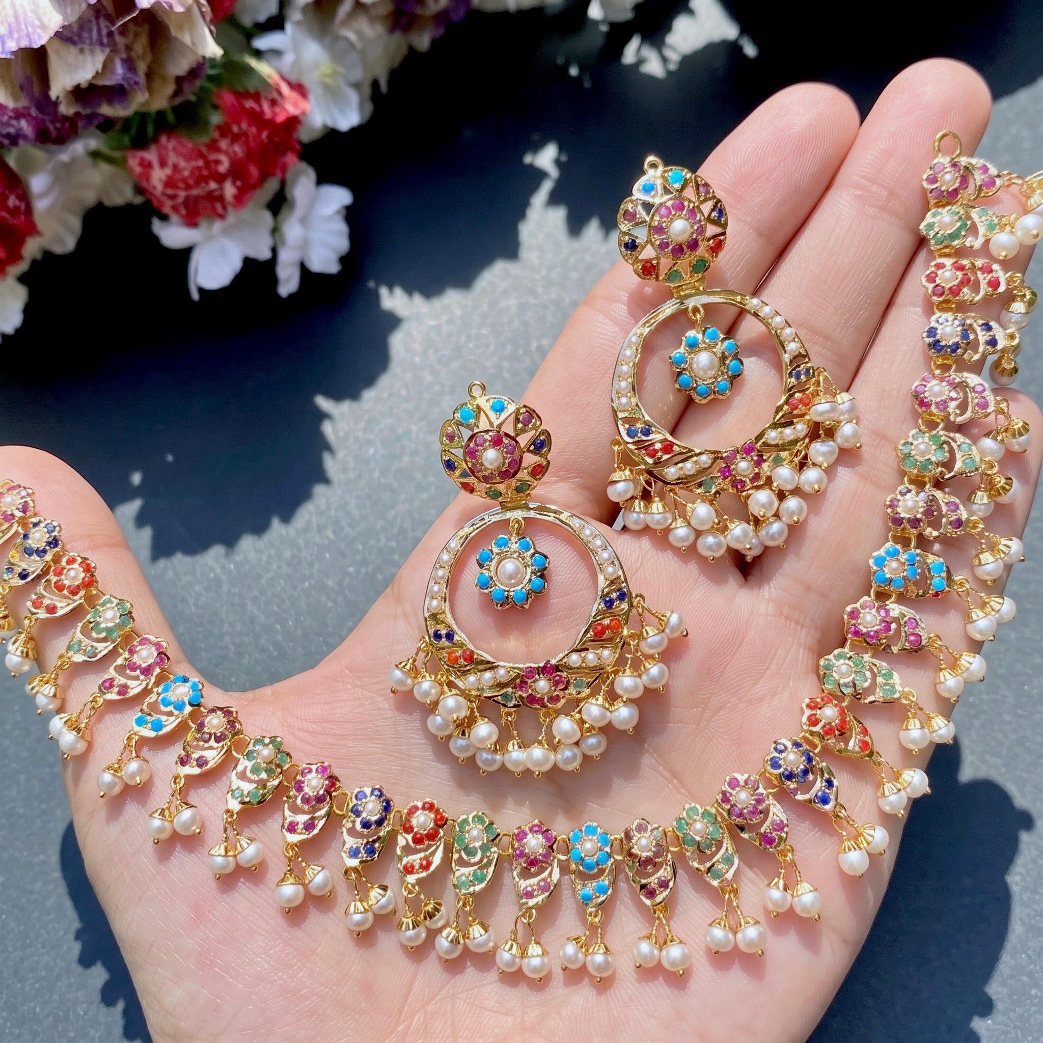 traditional indian / pakistani jadau jewelry on pure gold and studded with navratna stones