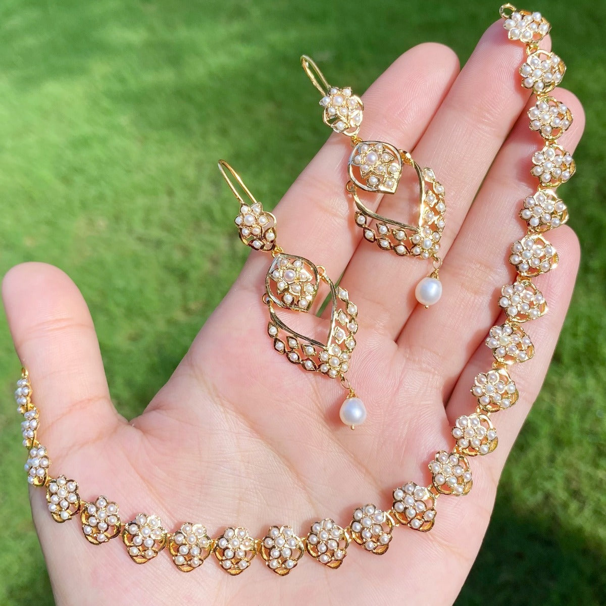 real pearl gold set under 150000 for women studded with pearls