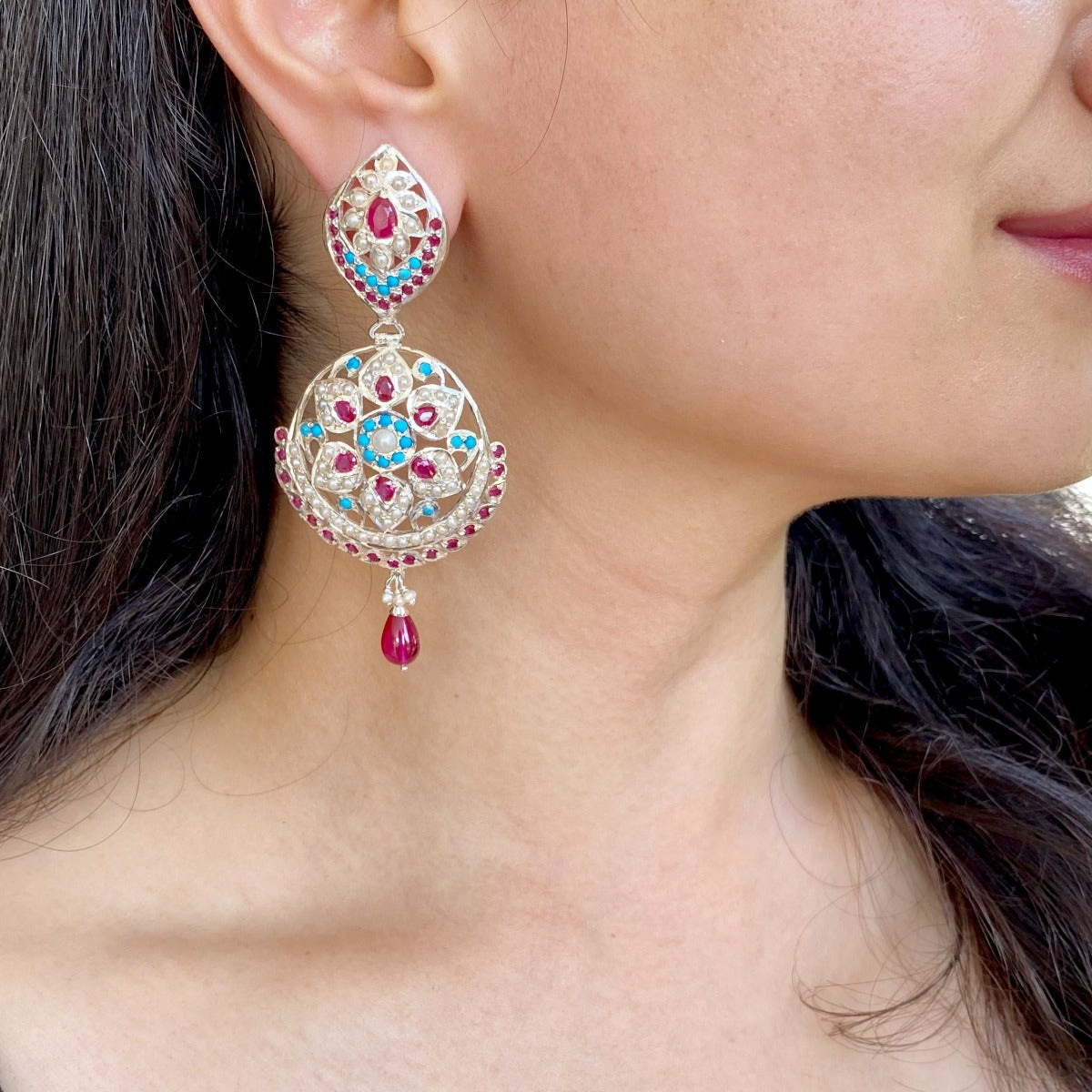 silver earrings with red blue stones