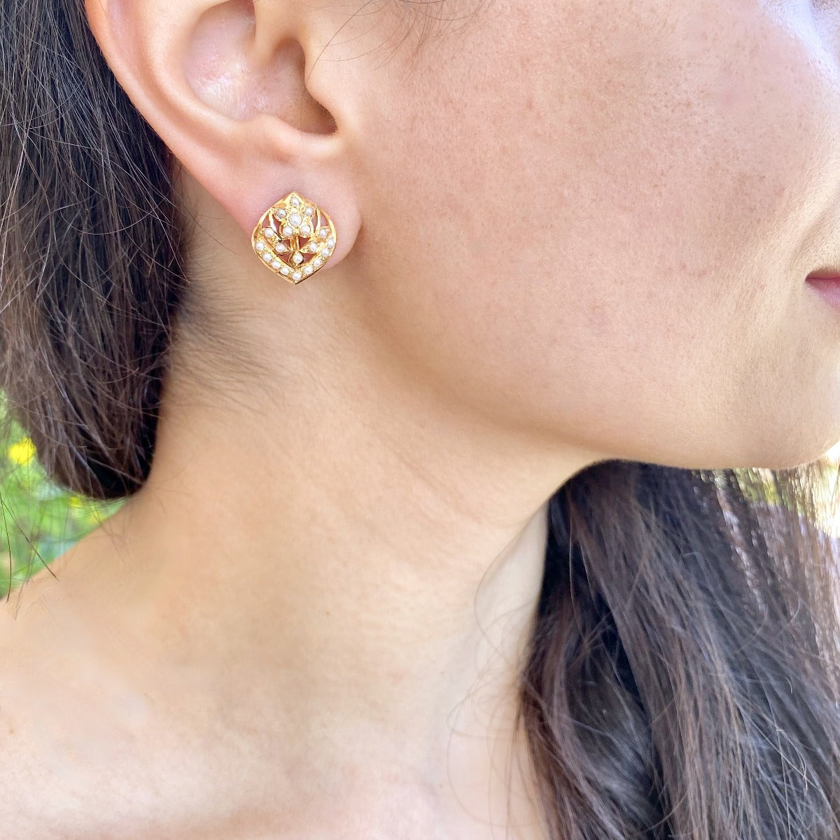 small gold stud earrings embelished with pearls