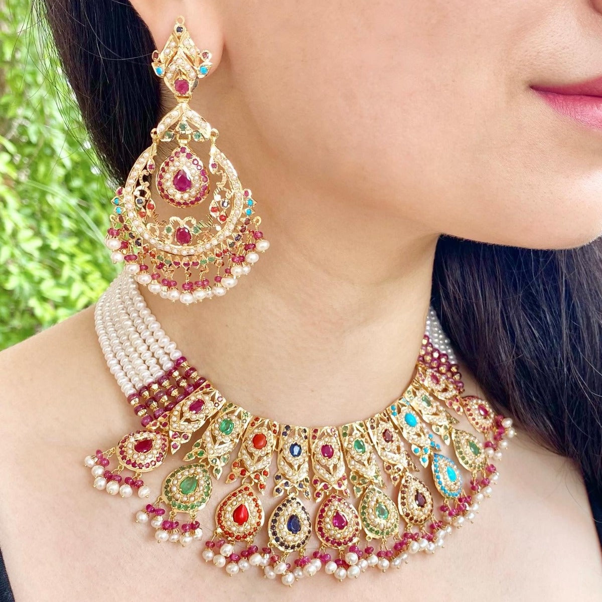 gold choker set with navaratna precious stones to pair up with a wedding lehenga. The design inspiration come from tanishq jewellers gold collection