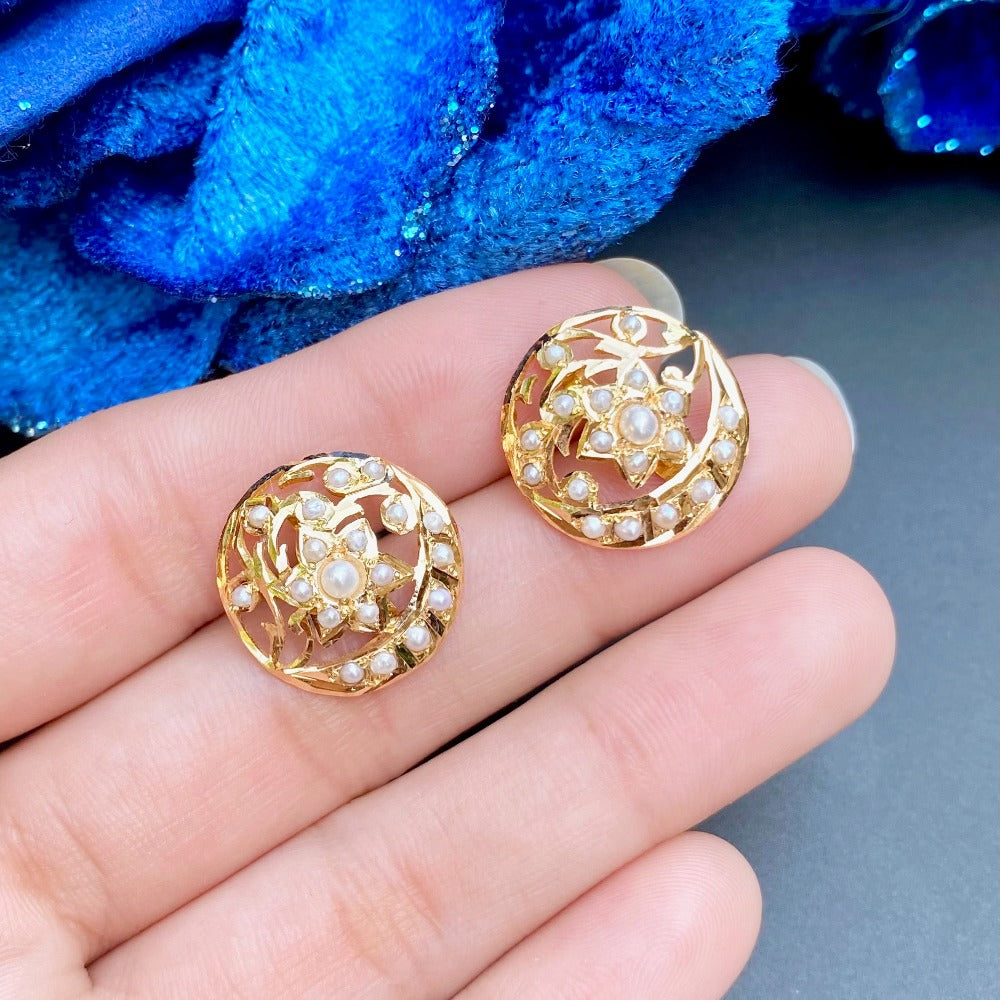 gold stud earrings embelished with freshwater pearls