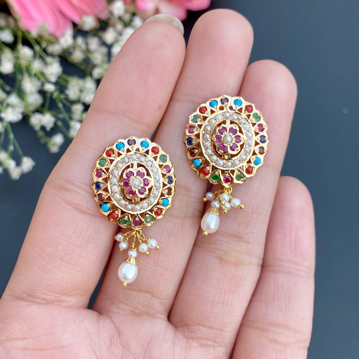 indian navratna studs design in oval shape