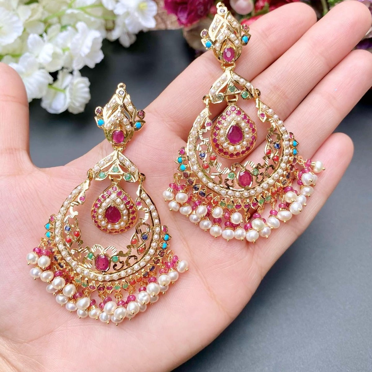 statement gold chandbali in navaratna colors for bridal wear. Goes perfectly with traditional wedding clothing like lehenga or saree. The design inspiration comes from tanishq jewellers' gold necklace set collection