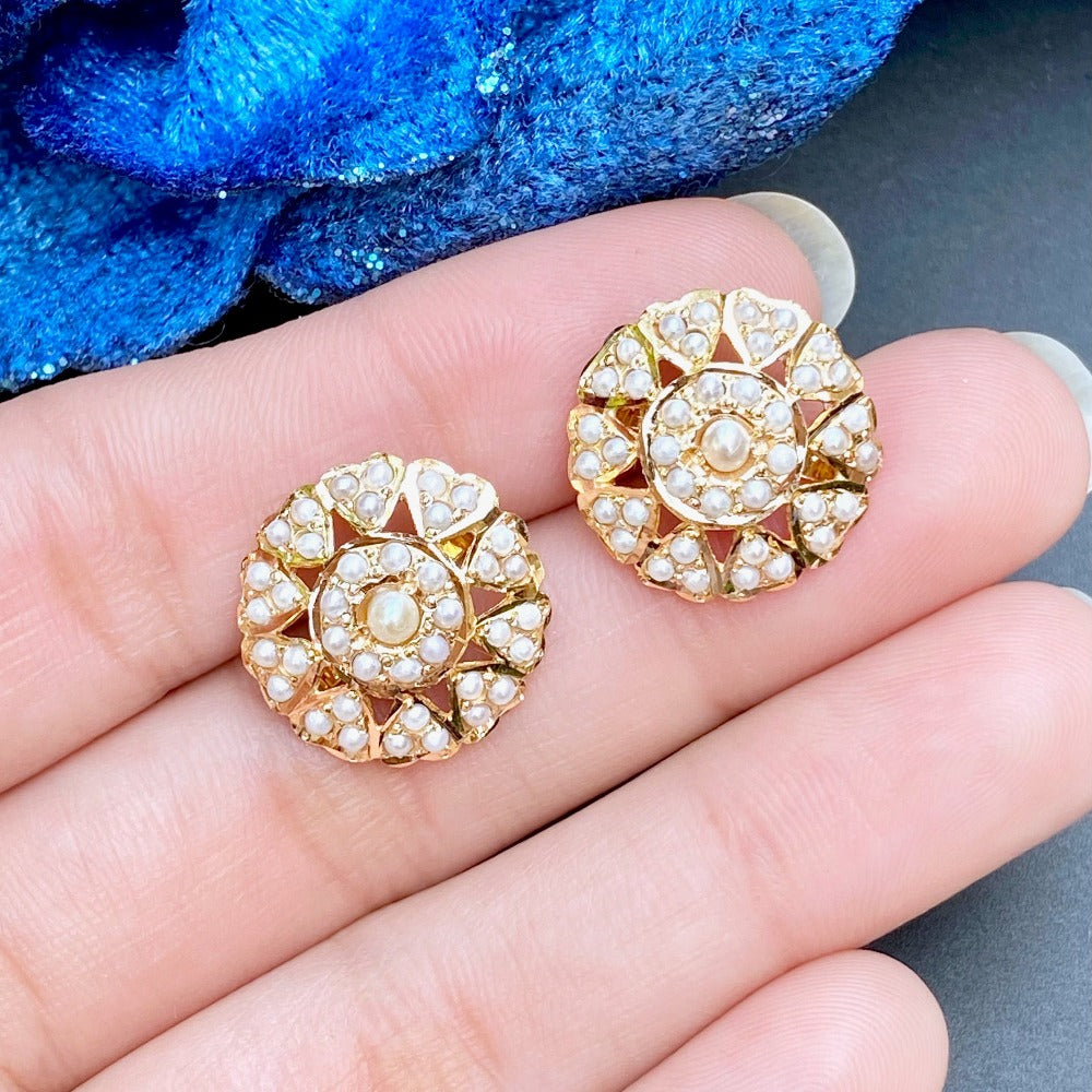 round pearl studs in gold