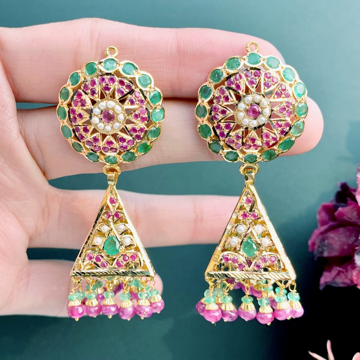 22k gold indian jhumka earrings studded with emeralds and rubies